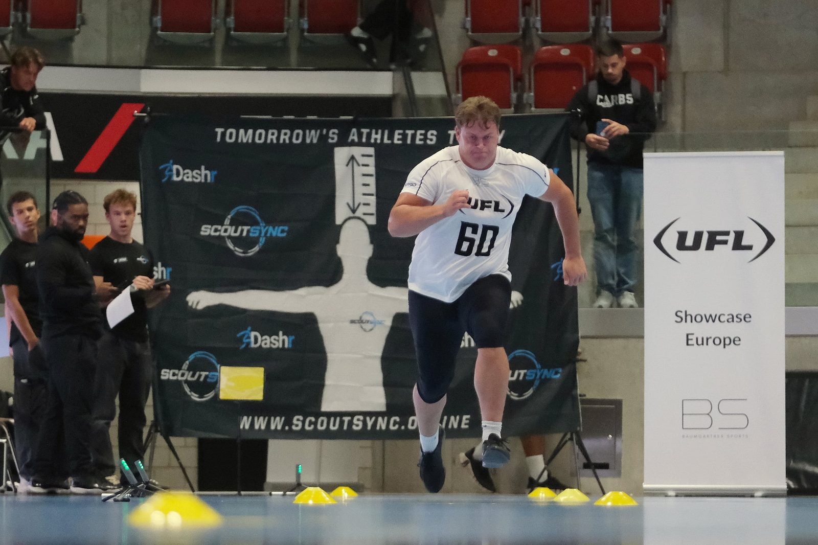 Athlete sprinting through timed testing at the UFL Showcase Europe combine powered by ScoutSync